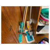 Kitchen Cabinet Contents with Bowls, Cups, Pots, Cleaning Tools and Supplies