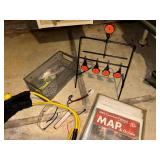 Group of Hunting and Fishing Gear with Slingshot, Target, Map Guides, and Accessories