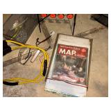 Group of Hunting and Fishing Gear with Slingshot, Target, Map Guides, and Accessories