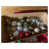 Collection of Christmas Ornaments and Decorative Santa Figures