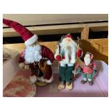 Collection of Vintage Santa Claus Figures and Holiday Decor
