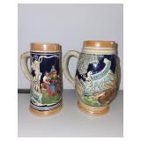 Pair of Vintage German Beer Steins with Relief Scenes