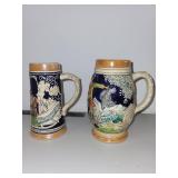 Pair of Vintage German Beer Steins with Relief Scenes