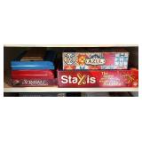 Games and Puzzles including Staxis, Trivial Pursuit, Scrabble, Clue and More!