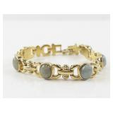 Gold-Tone Bracelet with Green Stone Accents
