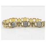 Gold-Tone Bracelet with Green Stone Accents