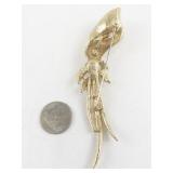 Sarah Coventry Gold Tone Floral Brooch with Rhinestones and Red Stone