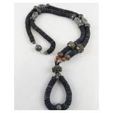 Ethnic Style Necklace with Black Disc Beads and Ornate Silver-Tone Accents