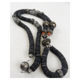 Ethnic Style Necklace with Black Disc Beads and Ornate Silver-Tone Accents