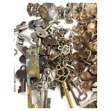 Lot of Crafting Brass Hardware, Keys, and Decorative Metal Pieces in Tin Bin