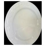 A Set of 8 Assorted Ivory Dinner Plates