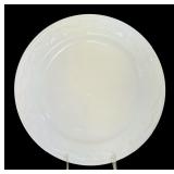 A Set of 8 Assorted Ivory Dinner Plates