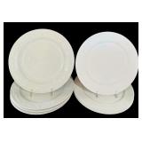 A Set of 8 Assorted Ivory Dinner Plates