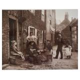 Pair of Framed Frank Sutcliffe Sepia Photographs, Quayside Fish Stall and Girls Skaning Mussels