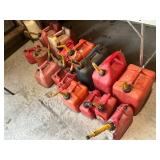 Collection of 14 Used Fuel Cans of Various Sizes and Colors