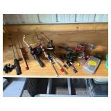 Collection of Fishing Rods and Reels with Fishing Accessories