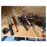 Collection of Fishing Rods and Reels with Fishing Accessories