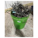 Bucket of Mixed Metal Hooks and Pegboard Hangers