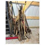 Lot of Assorted Garden Tools Including Shovels, Rakes, and Hoes