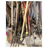 Lot of Assorted Garden Tools Including Shovels, Rakes, and Hoes