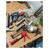 Collection of Caulk Guns, Tape Measure, Spray Gun, and Hardware Fasteners
