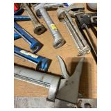 Collection of Caulk Guns, Tape Measure, Spray Gun, and Hardware Fasteners