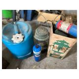 Vintage Coleman Lantern with Propane Tanks and Blue Water Jug