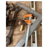 Assorted Vintage Hand Tools Including Levels, Wrenches, and Clamps