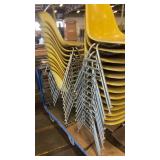 Lot of Stacking Yellow Plastic Chairs with Metal Legs on Rolling Cart