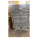 Stack of Plastic Nestable Pallets with Red Edges