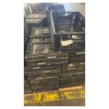 Pallet of Stackable Black Plastic Crates and Totes