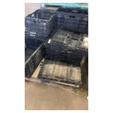 Stack of Black Plastic Crates for Storage or Transport