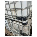 Stack of Used 275-Gallon IBC Tote Tanks with Metal Cages
