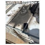 Stack of Used 275-Gallon IBC Tote Tanks with Metal Cages