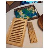 Kitchen Items including Knives, Farberware Meat Tenderizer, Wicker Tray, and Bamboo Bread Slicer