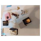 Assorted Jewelry and Accessories including Avon Watch, Pendants, Necklaces, and Compact Mirror