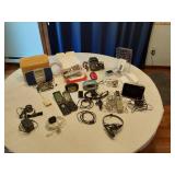 Assorted Electronics and Accessories including Flip Phones, Portable FM Scan Radio, TomTom GPS, and Digital Picture Viewer