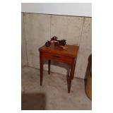 Vintage Wooden Sewing Machine Table with Red Toy Motorcycle