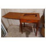 Vintage Wooden Sewing Machine Table with Red Toy Motorcycle