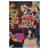 Easter and Spring Decoration Lot such as light-up bunny figures, floral arrangements, Easter baskets with eggs, and plush bunnies