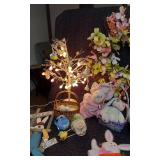 Easter and Spring Decoration Lot such as light-up bunny figures, floral arrangements, Easter baskets with eggs, and plush bunnies
