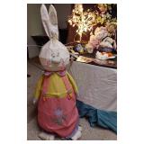Easter and Spring Decoration Lot such as light-up bunny figures, floral arrangements, Easter baskets with eggs, and plush bunnies