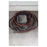 Extension cords, grease gun, and air hoses with accessories