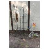 Metal garden decor including Shepherds hooks,  plant stands, bird decorations, and windmill