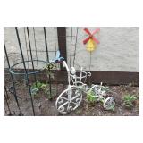 Metal garden decor including Shepherds hooks,  plant stands, bird decorations, and windmill
