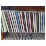Wood CD Storage Tower Filled with CDs Wood CD Storage Tower Filled with CDs