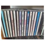 Wood CD Storage Tower Filled with CDs Wood CD Storage Tower Filled with CDs
