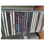 Wood CD Storage Tower Filled with CDs Wood CD Storage Tower Filled with CDs