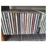 Wood CD Storage Tower Filled with CDs Wood CD Storage Tower Filled with CDs