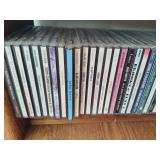 Wood CD Storage Tower Filled with CDs Wood CD Storage Tower Filled with CDs